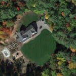 satellite image of house with green lawn