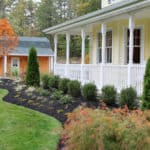 landscape design of shrubs and perennials in front of a house