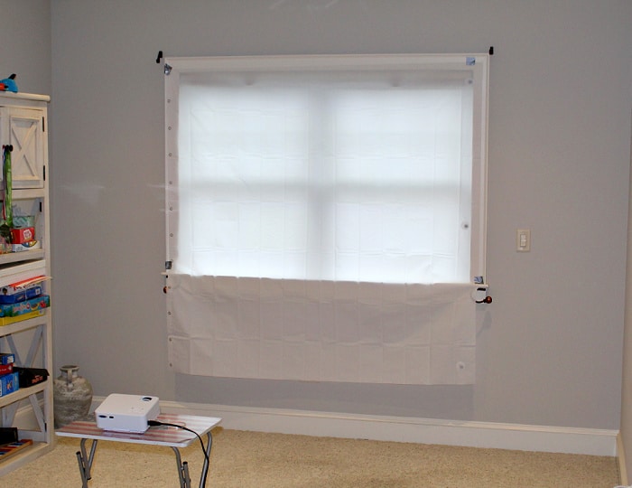 Projector aimed at window covered with shower curtain